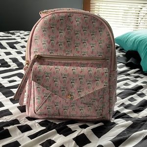 A pink backpack purse